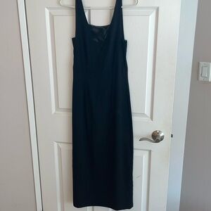 Black midi, sleek dress with sheer cut outs and low back